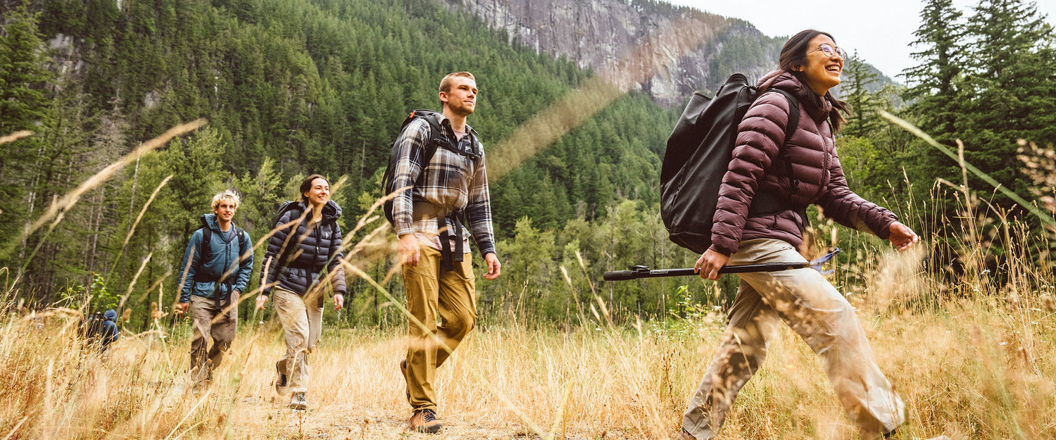4 climbers with BD climbing packs make their way to the crag.