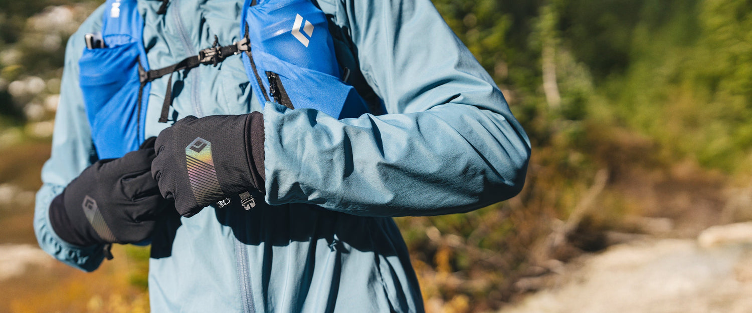 A runner adjusts his distance hydration vest