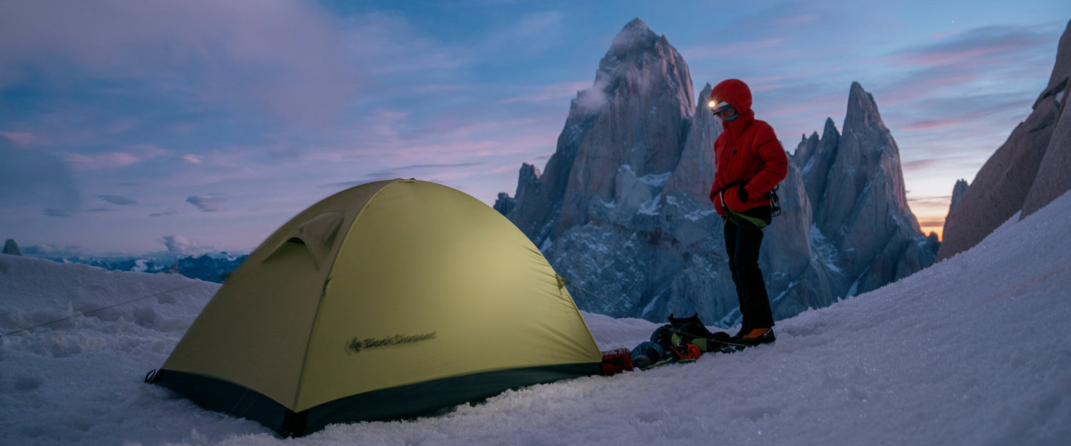A climber sets up basecamp in Patagonia