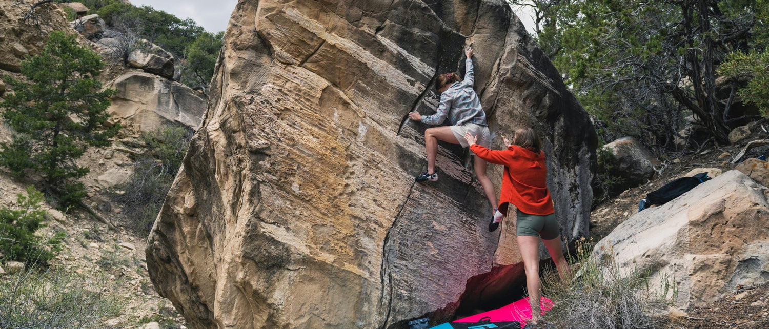 A boulderer gets a spot in Joes Valley.