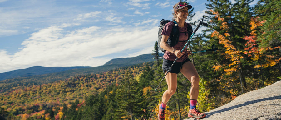 BD athlete  Hillary Gerardi runs through a forest.