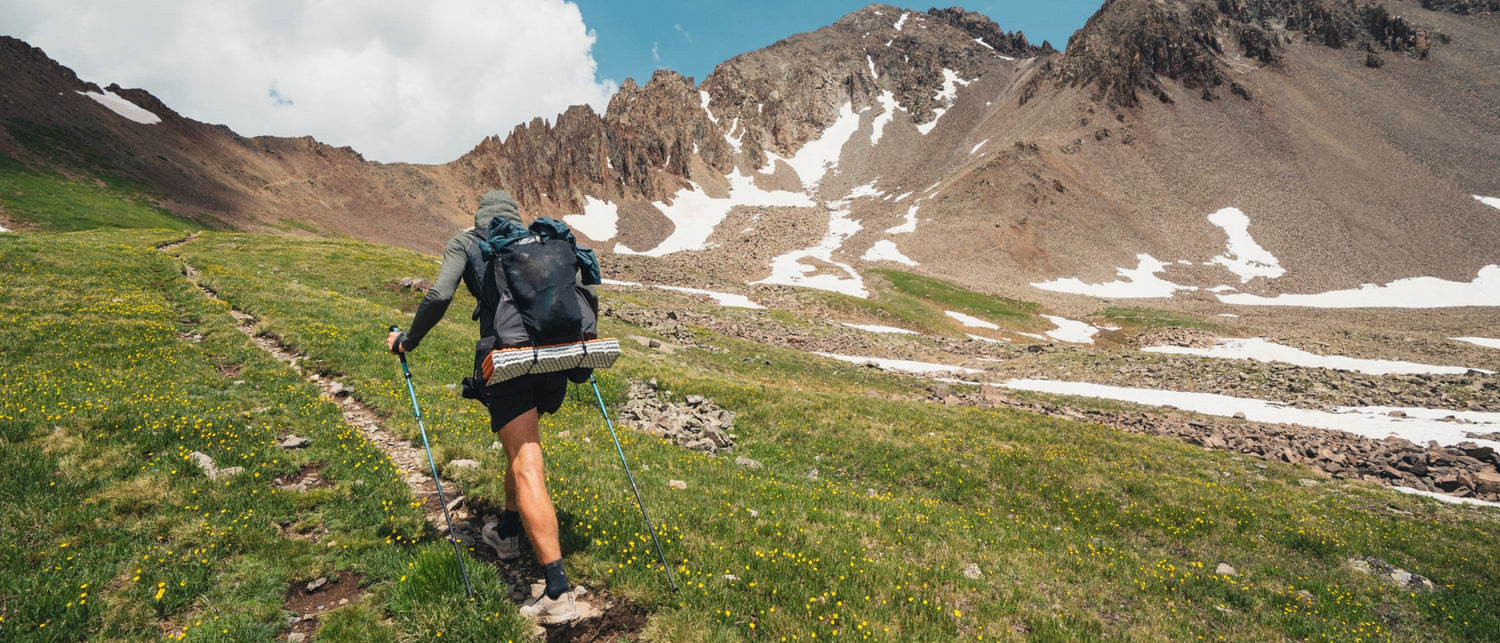BD athlete Joe Grant hikes a trail in the San Juans.