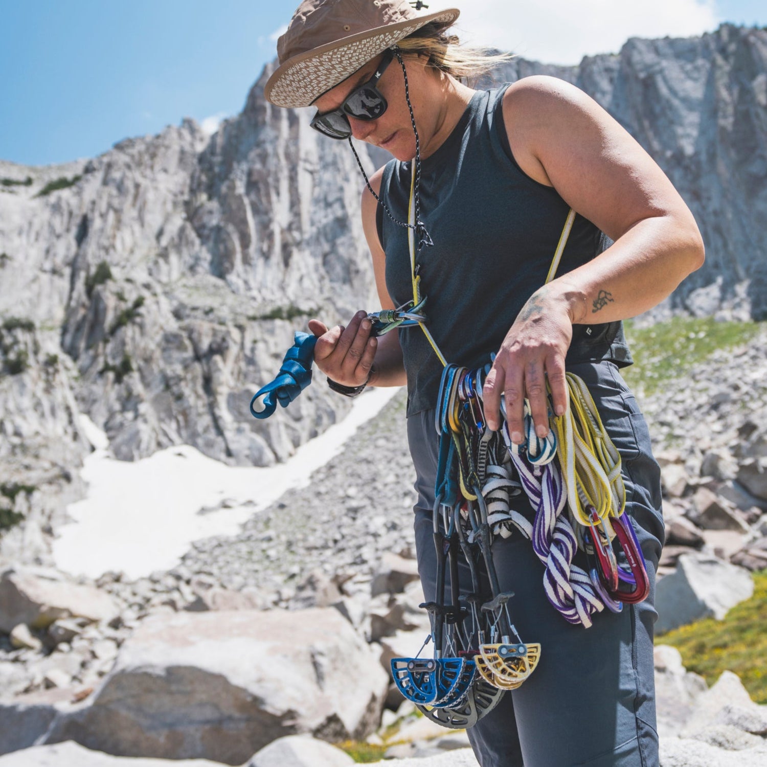 A climber racks up after a day of climbing.