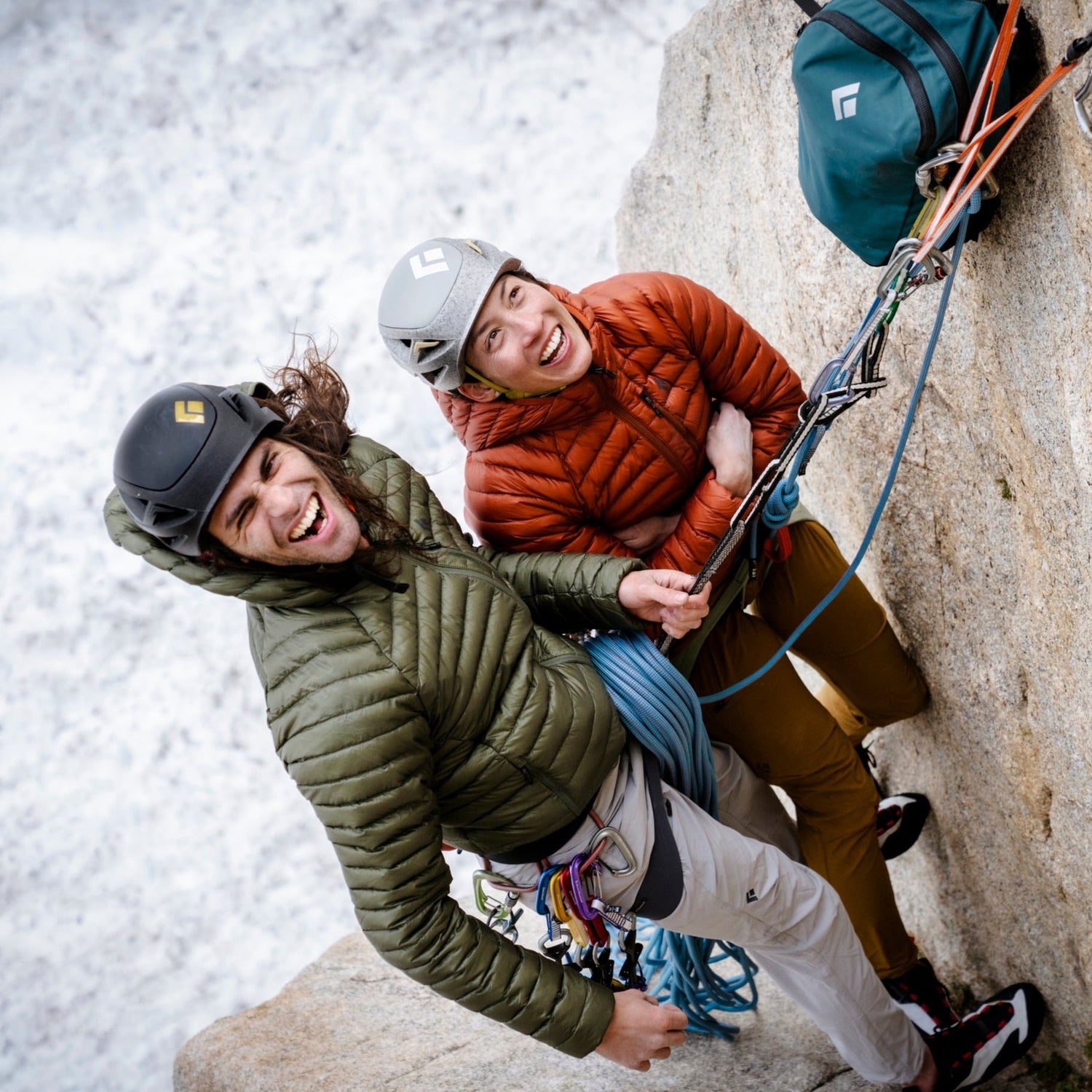 Two climbers in Black Diamond puffys.