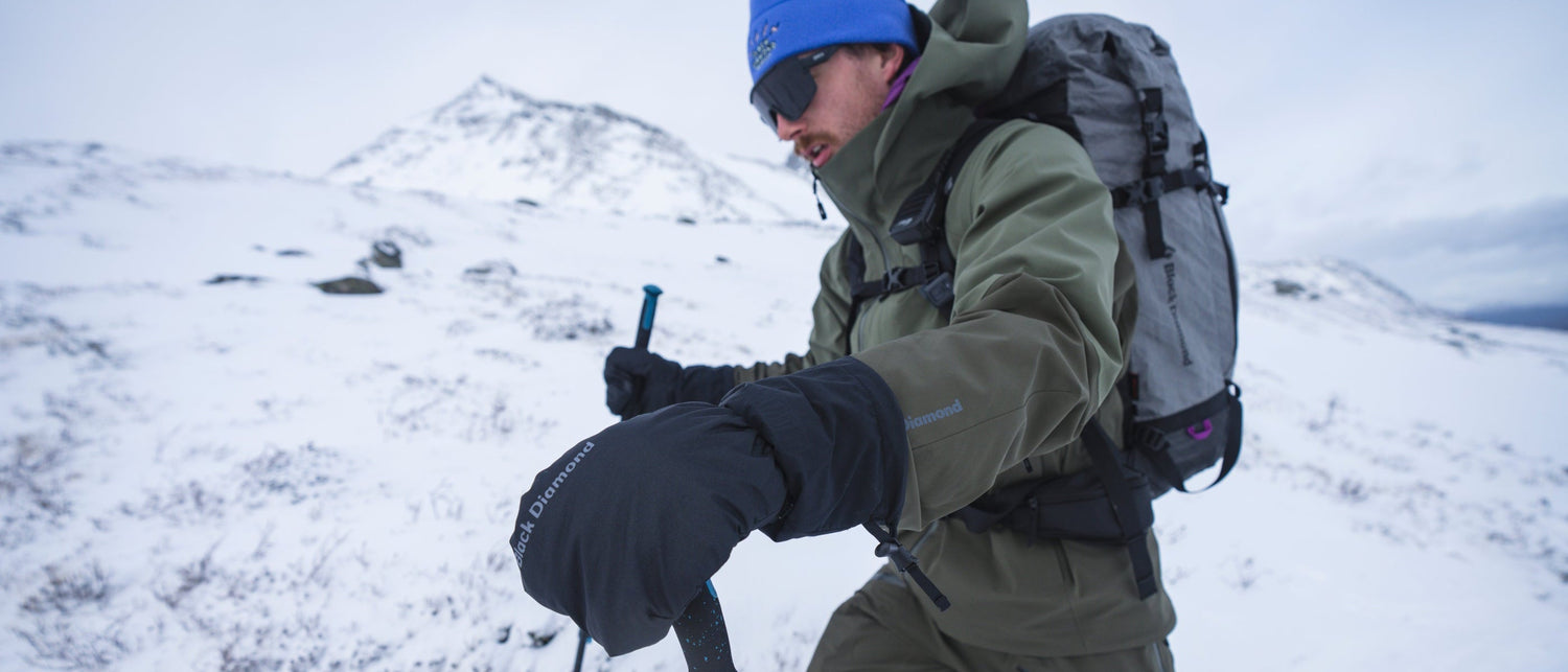 A ski tourer wears Black Diamond gloves.