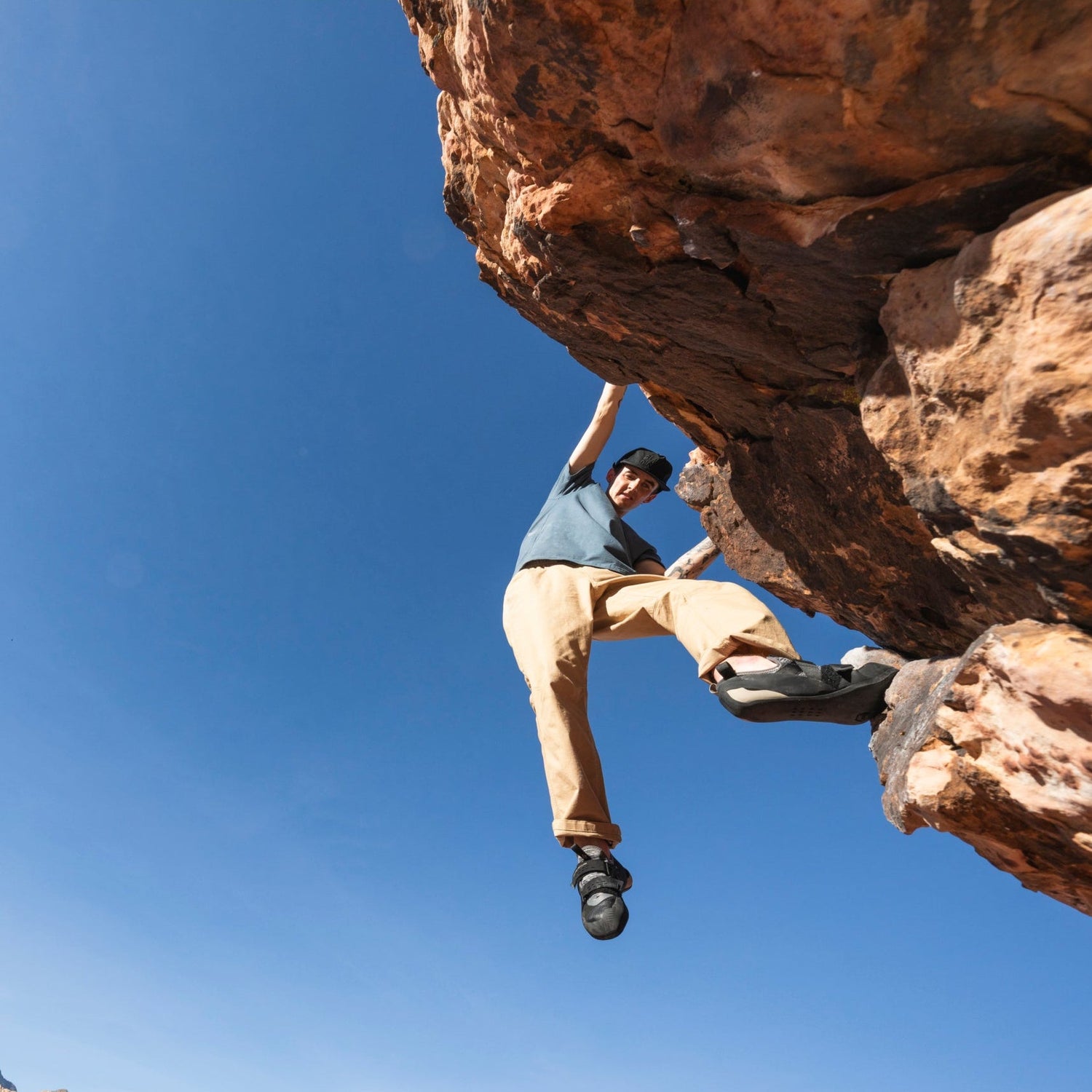 A bouderer wearing Sequence pants.